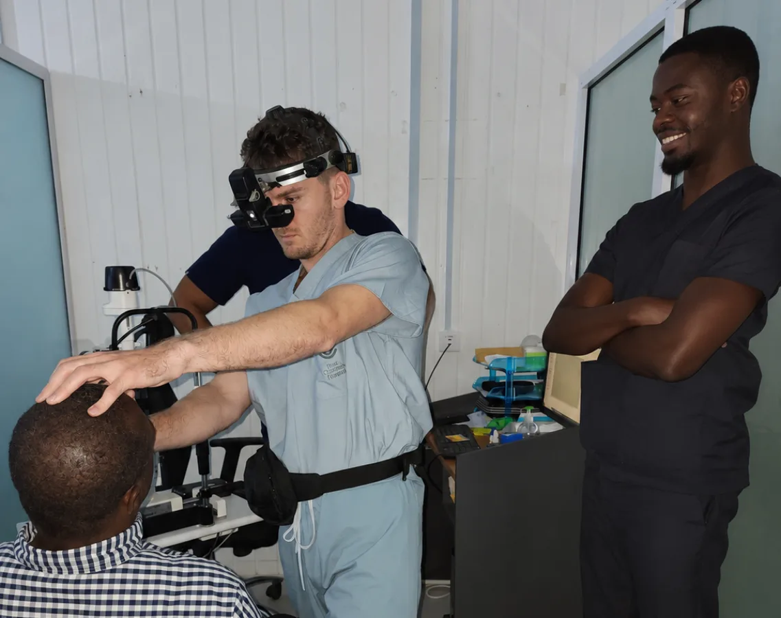 Dr. Jesse Terrell examining a patient with a headset ophthalmoscope during a medical mission trip